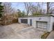 Garage and parking area behind the house with glass doors at 570 Flat Shoals Se Ave, Atlanta, GA 30316