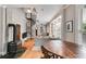 Open-concept living room with fireplace, spiral staircase, and lots of seating at 570 Flat Shoals Se Ave, Atlanta, GA 30316