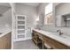 Modern bathroom with double vanity, granite countertop, and large mirror at 1974 Ellwyn Dr, Brookhaven, GA 30341