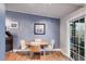 Cozy dining area with light wood table and four chairs at 1974 Ellwyn Dr, Brookhaven, GA 30341