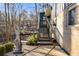 Modern home with gray stairs and stone patio at 1974 Ellwyn Dr, Brookhaven, GA 30341