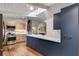 Modern kitchen with blue cabinetry and marble countertops at 1974 Ellwyn Dr, Brookhaven, GA 30341