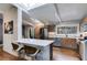 Modern kitchen with wood cabinets, quartz countertops, and stainless steel appliances at 1974 Ellwyn Dr, Brookhaven, GA 30341