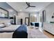 Main bedroom with hardwood floors, a ceiling fan, and large windows at 1974 Ellwyn Dr, Brookhaven, GA 30341