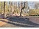 Landscaped pathway with wood benches in wooded area at 1974 Ellwyn Dr, Brookhaven, GA 30341