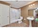 Basement bathroom with pedestal sink, shower/tub combo, and tiled floor at 2013 Parador Bnd, Mcdonough, GA 30253