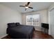 Bright bedroom featuring a ceiling fan and hardwood floors at 2013 Parador Bnd, Mcdonough, GA 30253