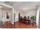 Dining room featuring hardwood floors and a large wooden table with seating at 2013 Parador Bnd, Mcdonough, GA 30253