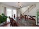 Bright dining room with hardwood floors, chandelier, and access to backyard at 2013 Parador Bnd, Mcdonough, GA 30253