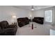 Living room with neutral carpeting and ample natural light at 2013 Parador Bnd, Mcdonough, GA 30253