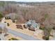 Aerial view of the home and neighborhood featuring beautiful landscaping and mature trees at 2109 Rocky Falls Nw Ct, Kennesaw, GA 30152