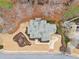 Aerial view of home displays backyard patio, beautiful landscaping, and paved driveway at 2109 Rocky Falls Nw Ct, Kennesaw, GA 30152