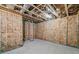 Spacious unfinished basement with exposed beams and insulation, ready for customization and expansion at 2109 Rocky Falls Nw Ct, Kennesaw, GA 30152