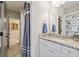 Granite vanity in bathroom featuring white cabinets, modern fixtures, and a separate shower room at 2109 Rocky Falls Nw Ct, Kennesaw, GA 30152