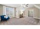 Expansive bedroom features a vaulted ceiling, natural light, and cozy seating area at 2109 Rocky Falls Nw Ct, Kennesaw, GA 30152