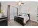 Cozy bedroom featuring a vaulted ceiling, a dark sleigh bed, and bright natural light at 2109 Rocky Falls Nw Ct, Kennesaw, GA 30152