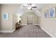 Spacious bonus room with vaulted ceilings, neutral paint, and modern ceiling fan at 2109 Rocky Falls Nw Ct, Kennesaw, GA 30152