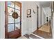 Inviting entryway featuring hardwood floors, decorative accents, and an elegant glass door at 2109 Rocky Falls Nw Ct, Kennesaw, GA 30152