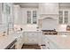 Gourmet kitchen with white cabinetry, subway tile backsplash, and professional-grade appliances at 2109 Rocky Falls Nw Ct, Kennesaw, GA 30152