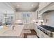 Well-lit kitchen showcases white cabinets, granite countertops, subway tile backsplash and a gas range at 2109 Rocky Falls Nw Ct, Kennesaw, GA 30152