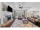 Inviting living room with a fireplace, coffered ceilings, dark wood trim, and ample seating at 2109 Rocky Falls Nw Ct, Kennesaw, GA 30152