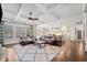 Open-concept living room with coffered ceiling, fireplace, hardwood floors, and an eat-in kitchen at 2109 Rocky Falls Nw Ct, Kennesaw, GA 30152