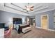 Spacious main bedroom with ensuite bathroom, ceiling fan, and sitting area at 2109 Rocky Falls Nw Ct, Kennesaw, GA 30152