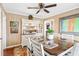 Bright dining room features a wood table, white chairs, and a built-in hutch at 3414 Alcan Way, Tucker, GA 30084