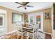 Bright dining room with a wooden table and chairs, and access to the backyard at 3414 Alcan Way, Tucker, GA 30084