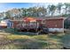 Brick ranch house with a deck and landscaped yard at 3414 Alcan Way, Tucker, GA 30084