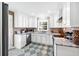 Modern kitchen with white cabinets and granite countertops at 3414 Alcan Way, Tucker, GA 30084