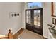 Interior view of entry with double doors and hardwood floors at 409 E Point Dr, Canton, GA 30115