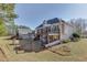 Two-story house with large deck and fenced backyard at 409 E Point Dr, Canton, GA 30115