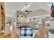 Open concept living room with kitchen views and exposed beams at 409 E Point Dr, Canton, GA 30115