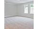 Spacious bedroom with carpet and large windows at 709 Trevett Way, Marietta, GA 30062