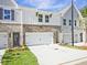 Townhomes with attached garages and landscaping at 709 Trevett Way, Marietta, GA 30062