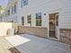 Private patio with brick wall and access to kitchen at 709 Trevett Way, Marietta, GA 30062