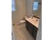 Clean bathroom with dark vanity, toilet and bathtub at 790 Hiram Davis Rd, Lawrenceville, GA 30045