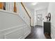 Bright entryway with hardwood floors, decorative molding, and staircase at 133 Regent Pl, Woodstock, GA 30188