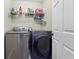 Efficient laundry room featuring modern washer and dryer set at 133 Regent Pl, Woodstock, GA 30188