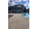 Community pool area surrounded by concrete at 133 Regent Pl, Woodstock, GA 30188