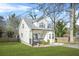 Charming two-story house with white siding, front porch, and landscaped lawn at 1995 Meador Ave, Atlanta, GA 30315