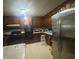 Kitchen with stainless steel appliances and wood cabinets at 5710 Stewart Mill Rd, Douglasville, GA 30135