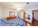 Bedroom featuring hardwood floors, ceiling fan, and ensuite bathroom at 5323 Lakesprings Dr, Dunwoody, GA 30338