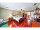 A primary bedroom features hardwood floors, a ceiling fan, and an ensuite bathroom at 5323 Lakesprings Dr, Dunwoody, GA 30338