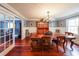 Elegant dining room featuring a large table, decorative chandelier, and hardwood floors at 5323 Lakesprings Dr, Dunwoody, GA 30338