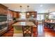 Well-appointed kitchen featuring a large island, granite countertops, and stainless steel appliances at 5323 Lakesprings Dr, Dunwoody, GA 30338