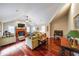 Bright living room with vaulted ceiling, fireplace, hardwood floors, and a ceiling fan at 5323 Lakesprings Dr, Dunwoody, GA 30338