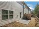 Backyard featuring a small patio, a fence, an AC Unit, a back door and the home's siding at 7744 Fawn Cir, Covington, GA 30014