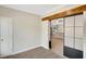 Bedroom featuring a modern barn door entrance and plush carpeting at 7744 Fawn Cir, Covington, GA 30014